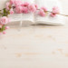 Bible with pink flowers on top