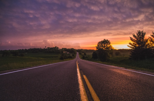 Sunrise over an empty country road
