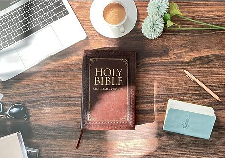 Laptop, coffee, and Bible with journal