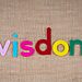 Word “wisdom” spelled out in colorful felt letters illustrate wise word from God