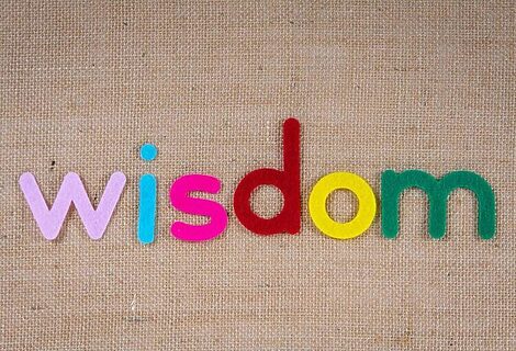 Word “wisdom” spelled out in colorful felt letters illustrate wise word from God