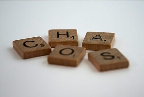 Scrabble pieces spell word chaos