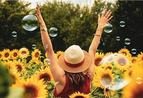 Woman with hands lifted represent praising God for being created purposefully