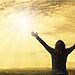 Woman raising hands to sun in sky illustrate discerning and hearing God’s voice