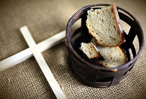 Image of bread in cup and cross represent fasting to hear God’s voice