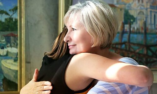 Older woman and younger woman hugging illustrate being a friend and allowing God to use someone as a blessing