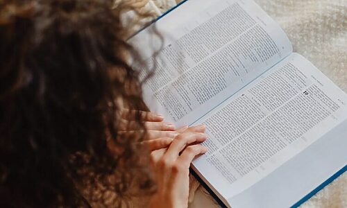 Woman reading bible illustrates learning about people called by God