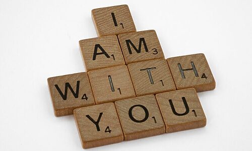 Scrabble pieces spell phrase “I am with You” in reference to God speaking with Moses. Illustrates having confidence in God for your calling.