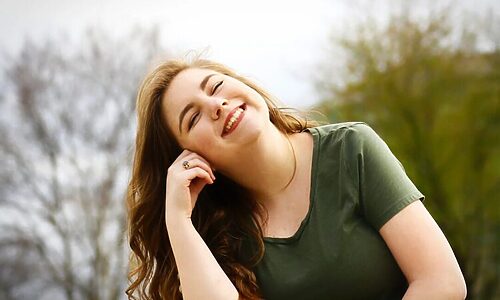 Woman smiling indicates finding contentment