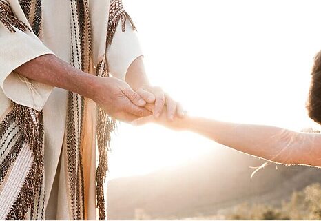 Image of Jesus holding a woman’s hand illustrates love of Jesus