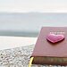 image of Bible with heart on top in outdoor setting represents God’s steadfast love