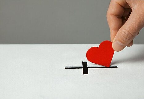 Image of heart next to cross represents God’s unconditional love