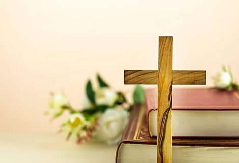 Cross and Bibles represent Matthew 21:9–a reminder that we needed a savior to save us from sin