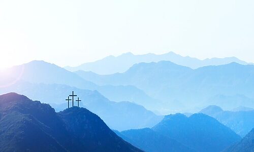 Image of 3 crosses on mountaintop illustrate Bible verses on what the Bible says about salvation