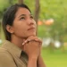 Image of woman looking up in hopeful prayer represents waiting on God and relying on God’s timing