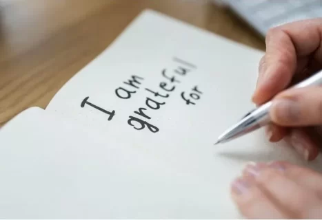 Image of journal with text, “I am grateful for” represents gratitude and trusting God