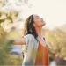 Woman with outstretched arms and closed eyes represents waiting on God and trusting in Him
