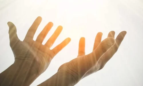 Image of uplifted hands represents faith in God’s promises and delayed blessings