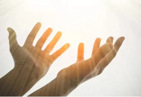 Image of uplifted hands represents faith in God’s promises